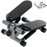 Grauer Mini-Stepper mit schwarzen Noppen-Pedalen und Widerstandsbändern.