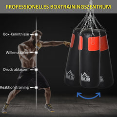Professionelles Boxtraining im Fitnessstudio: Mann schlägt gegen den schweren Sack.