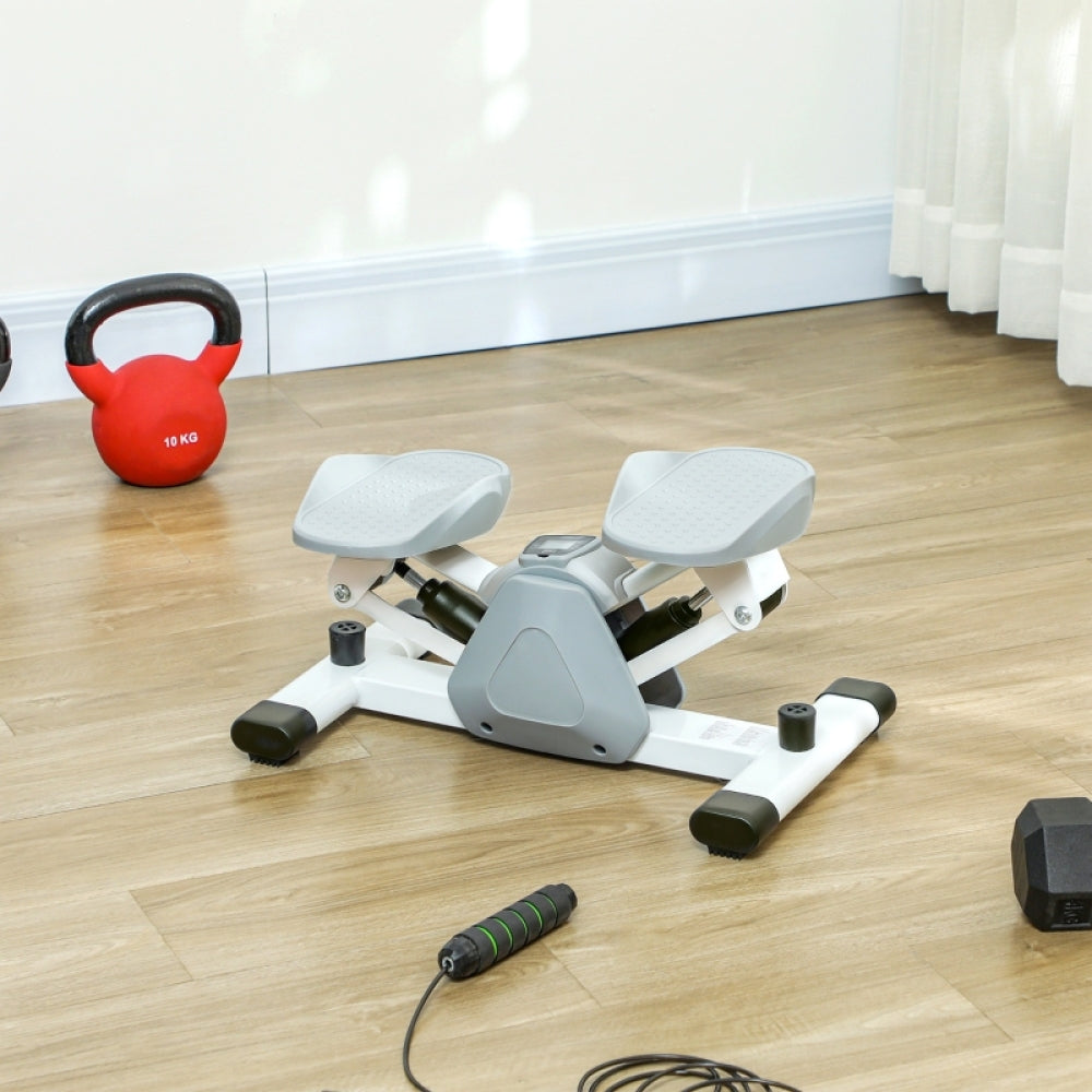 Fitnessgerät Stepper im Home Gym mit Hanteln