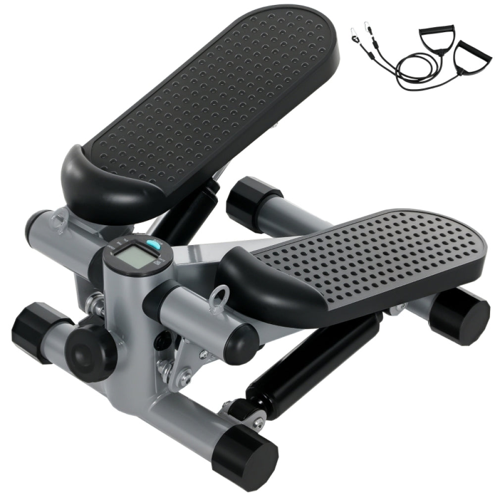 Grauer Mini-Stepper mit schwarzen Noppen-Pedalen und Widerstandsbändern.
