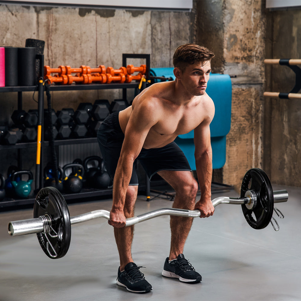Langhantel-Training: Mann nutzt 10kg Scheiben für Kreuzheben und Curls